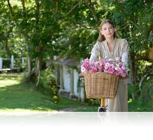 Nikon D610 photo of a woman in a garden showing detail