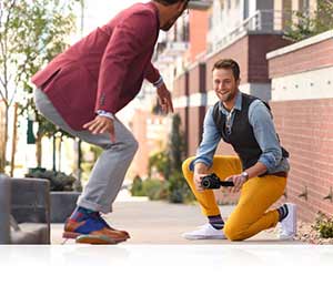 Nikon D5500 photo of a man photographing another man on a skateboard highlighting the Vari-angle LCD